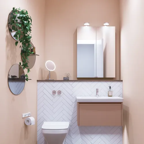 Kleine badkamerinspiratie met wastafelkastje in speciale kleur met geïntegreerde greep, spiegelkast met lampen, decoratieve spiegels met getinte glazenschap, witte visgraattegels geven een strakke en klassieke uitstraling.