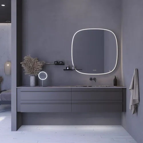 Grote badkamerinspiratie met grijs badmeubel met geïntegreerde handgreep, stijlvolle wastafel aan de zijkant, vierkante spiegel met afgeronde hoeken, betonlook muren en ruwe materialen voor een urban look