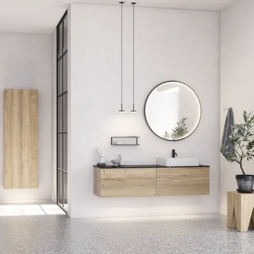 Grote stedelijke badkamerinspiratie met meubels van natuur eiken, stenen aanrechtblad met vierkante wastafel, ronde spiegel met zwarte rand, natuurlijke kleuren en terracotta vloer voor een industriële en moderne uitstraling
