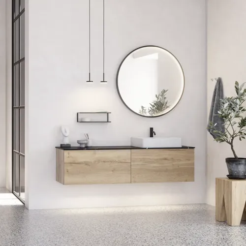 Grote stedelijke badkamerinspiratie met meubels van natuur eiken, stenen aanrechtblad met vierkante wastafel, ronde spiegel met zwarte rand, natuurlijke kleuren en terracotta vloer voor een industriële en moderne uitstraling