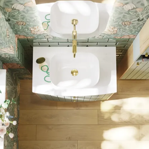 Badkamerinspiratie met groene meubels in speciale kleur met zijden van natuurlijk eikenhout, elegante groeven, werkblad met ovale opzetwastafel, ovale spiegel en bloemenbehang geeft een sierlijke, retro uitstraling.