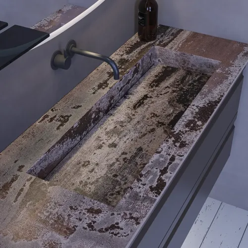 Grote badkamerinspiratie met grijs badmeubel met geïntegreerde handgreep, stijlvolle wastafel aan de zijkant, vierkante spiegel met afgeronde hoeken, betonlook muren en ruwe materialen voor een urban look